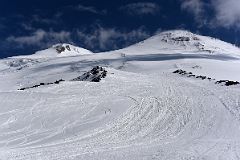 03A The Way Ahead To Pastukhov Rocks With Mount Elbrus West And East Summits Above.jpg